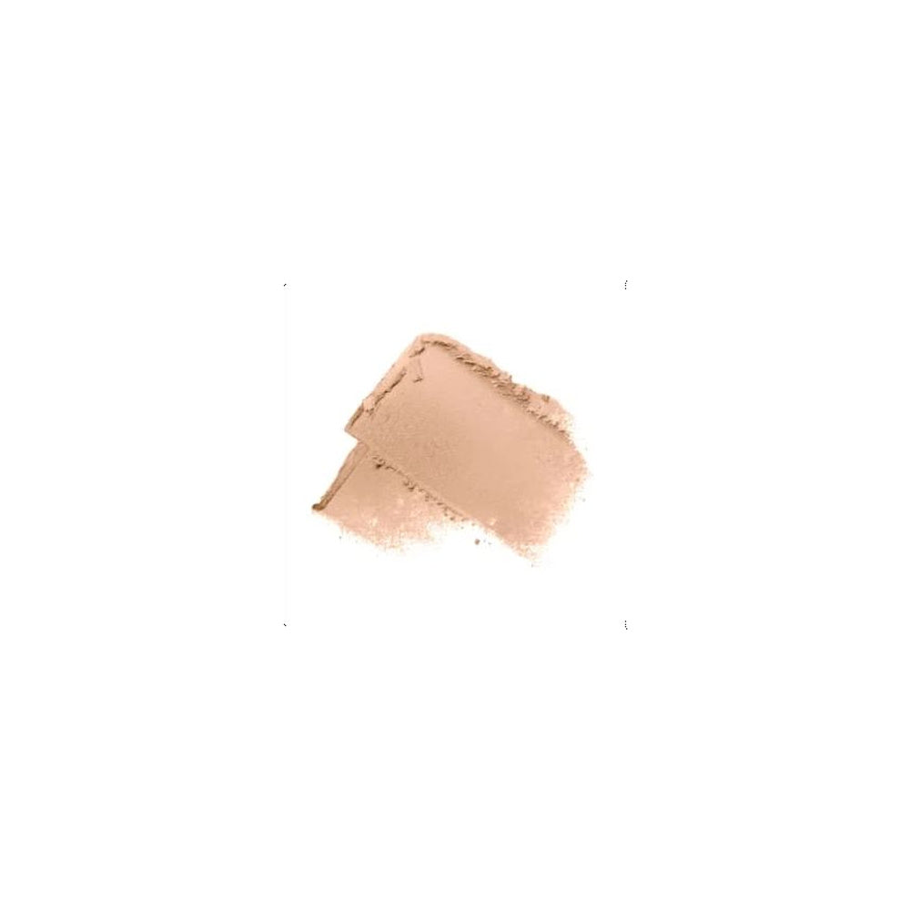 A textured swatch of light peach-beige cosmetic powder or cream makeup on a solid white background.