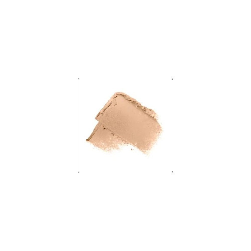 A textured swatch of light peach-beige cosmetic powder or cream makeup on a solid white background.