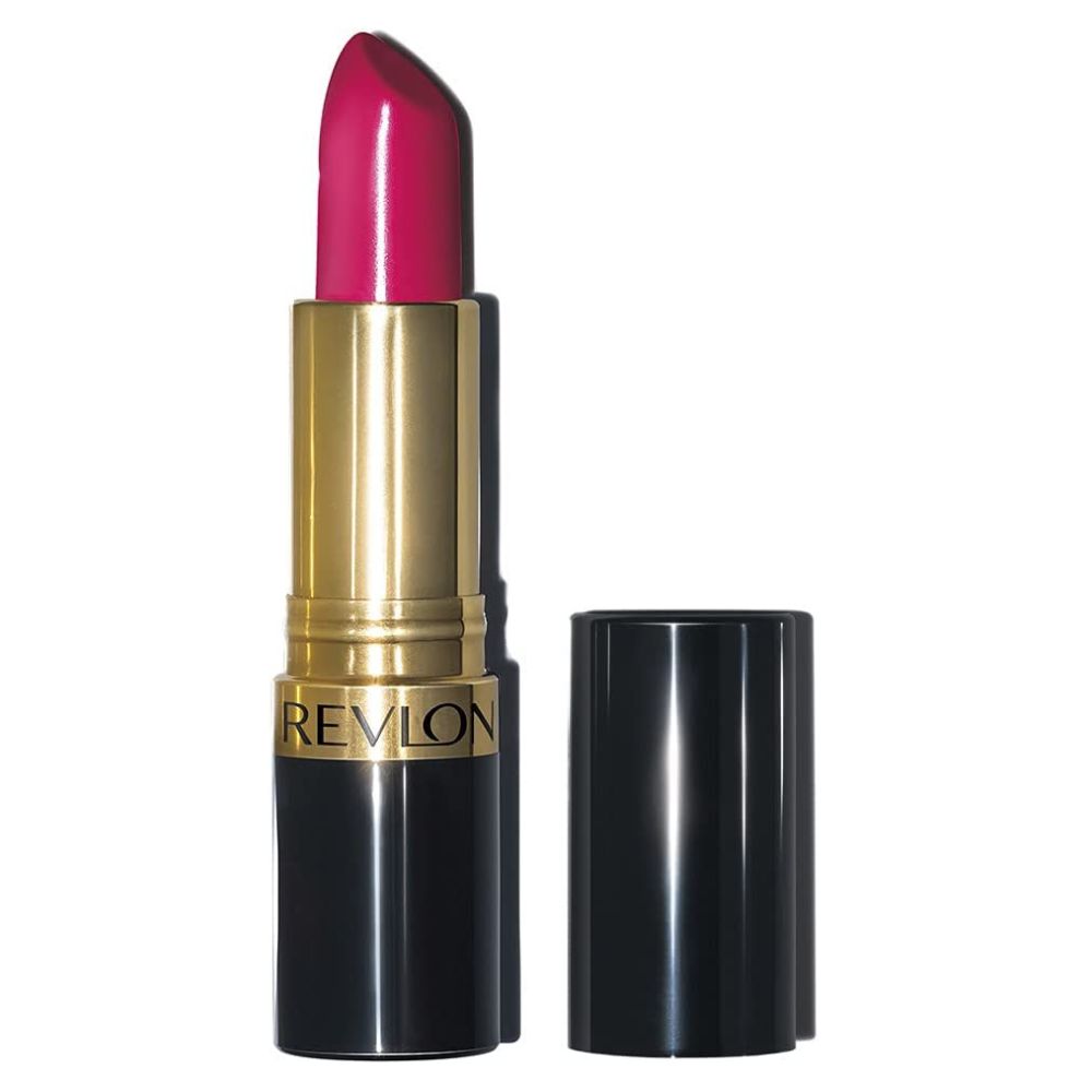 A Revlon lipstick in a bright pink shade, shown with its gold and black tube open and the cap placed beside it on a plain white background.
