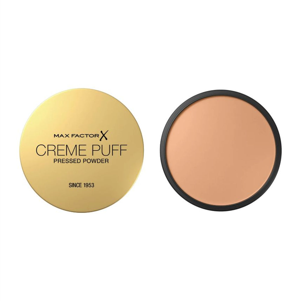 Max Factor Creme Puff pressed powder with gold lid and black case on a white background